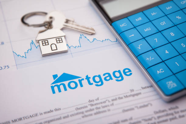 Blue text stating mortgage with a key and a calculator